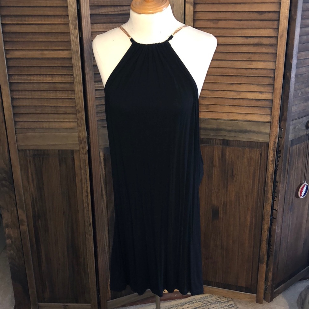 Backless dress with chains.